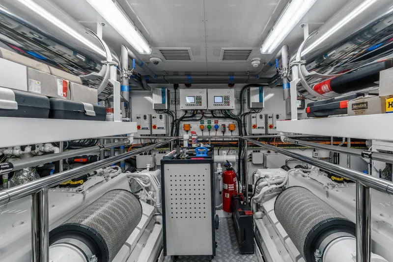 Noroader Yacht Photos Pics Engine room of a 2020 Sunseeker 116 yacht, featuring advanced machinery and control panels.