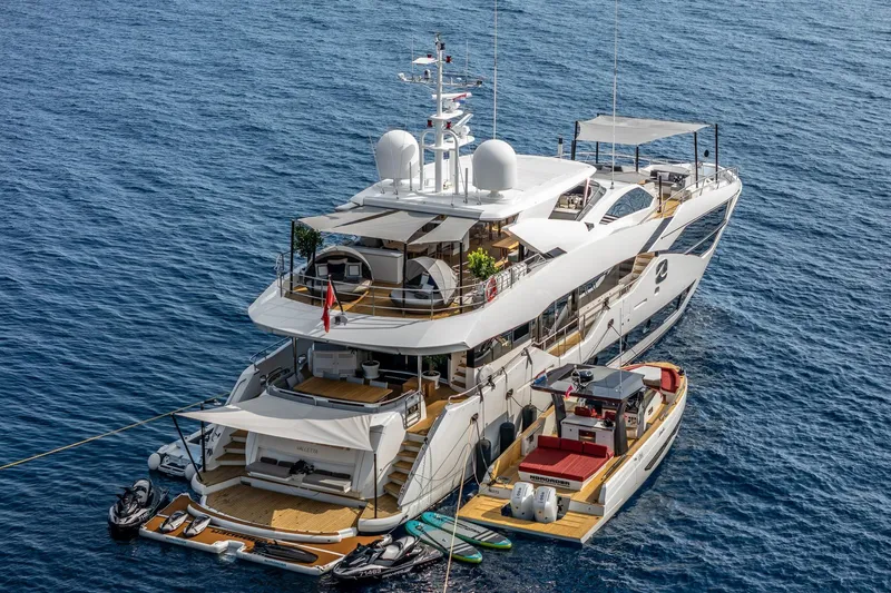 Noroader Yacht Photos Pics Luxurious 2020 Sunseeker 116 yacht on open sea, featuring multiple decks and a tender boat.