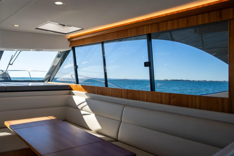  Yacht Photos Pics Interior of 2022 Riviera 445 SUV yacht with ocean view through large windows.