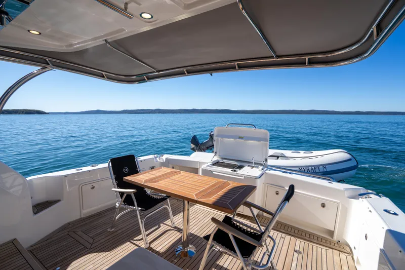  Yacht Photos Pics Luxury deck of 2022 Riviera 445 SUV yacht with ocean view.