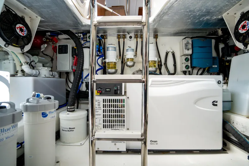  Yacht Photos Pics Engine room of 2022 Riviera 445 SUV with Onan generator and marine equipment.