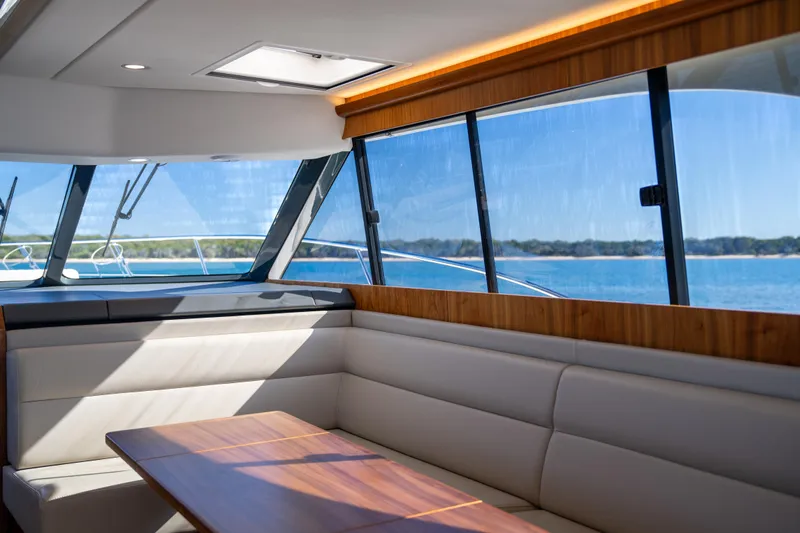  Yacht Photos Pics Interior of 2022 Riviera 445 SUV yacht with ocean view through large windows.