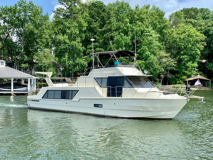 Paradise Falls Yacht Photos Pics 1988 Harbor Master 520 Coastal Yacht on calm water.