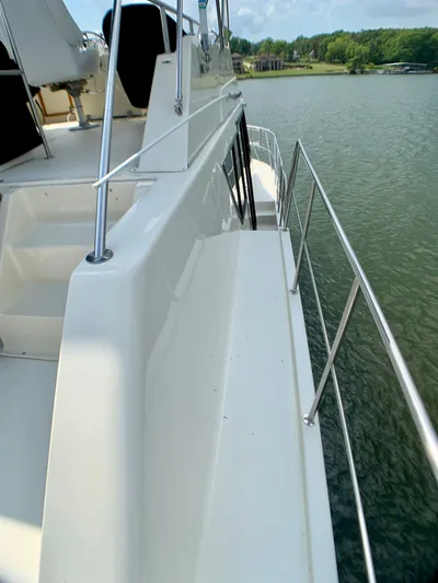 Paradise Falls Yacht Photos Pics 1988 Harbor Master 520 Coastal on a serene lake.