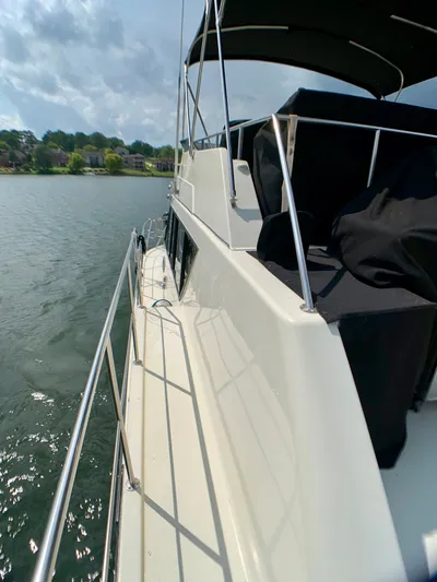 Paradise Falls Yacht Photos Pics 1988 Harbor Master 520 Coastal yacht on calm waters.