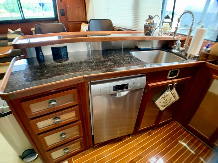 Paradise Falls Yacht Photos Pics Kitchen area on a 1988 Harbor Master 520 Coastal boat.