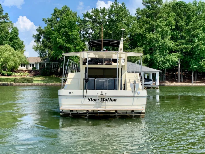 Paradise Falls Yacht Photos Pics 1988 Harbor Master 520 Coastal on a serene lake.