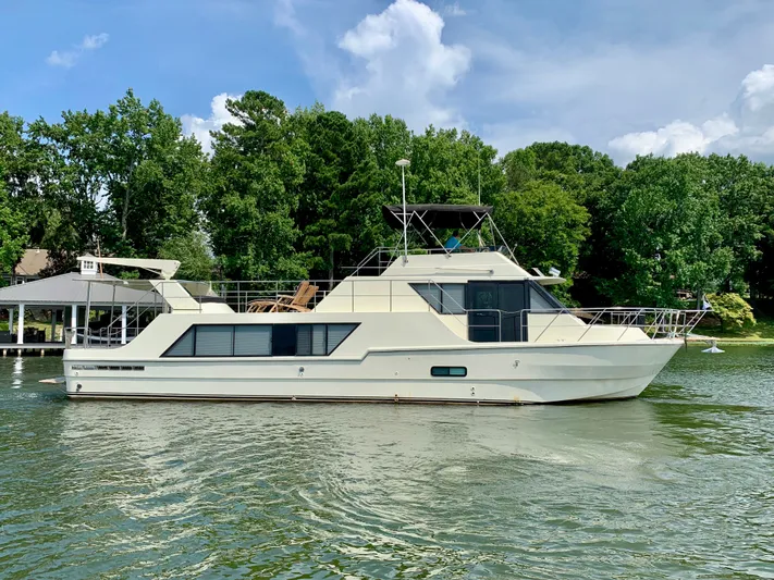 Paradise Falls Yacht Photos Pics 1988 Harbor Master 520 Coastal Yacht on calm water.