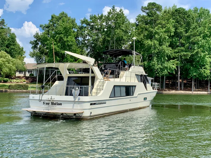 Paradise Falls Yacht Photos Pics 1988 Harbor Master 520 Coastal yacht on a serene lake.