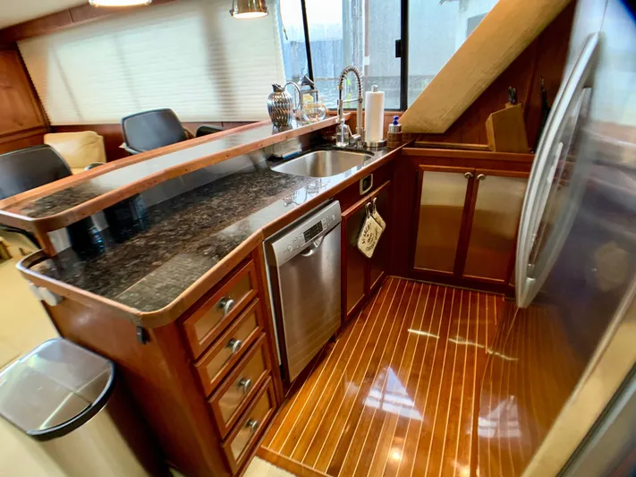Paradise Falls Yacht Photos Pics Interior view of 1988 Harbor Master 520 Coastal yacht kitchen.