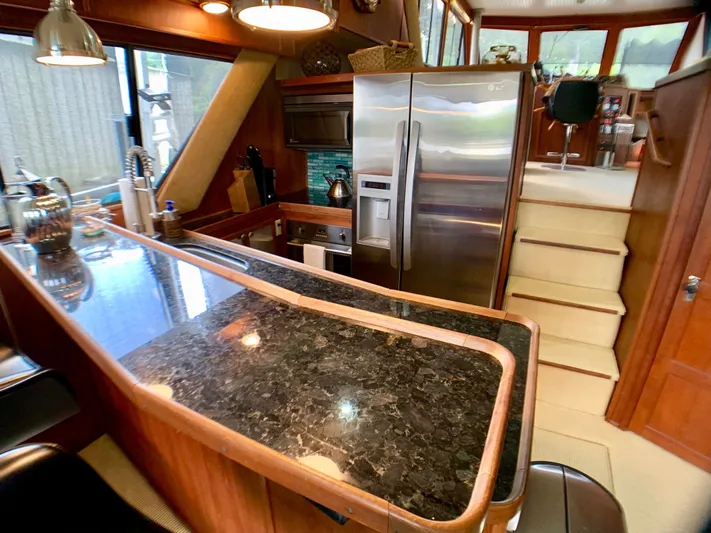 Paradise Falls Yacht Photos Pics Interior of 1988 Harbor Master 520 Coastal yacht with modern kitchen.