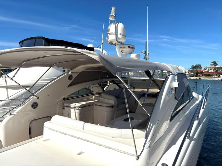 Blind Date Yacht Photos Pics 2005 Viking Princess V50 yacht docked under clear blue sky.