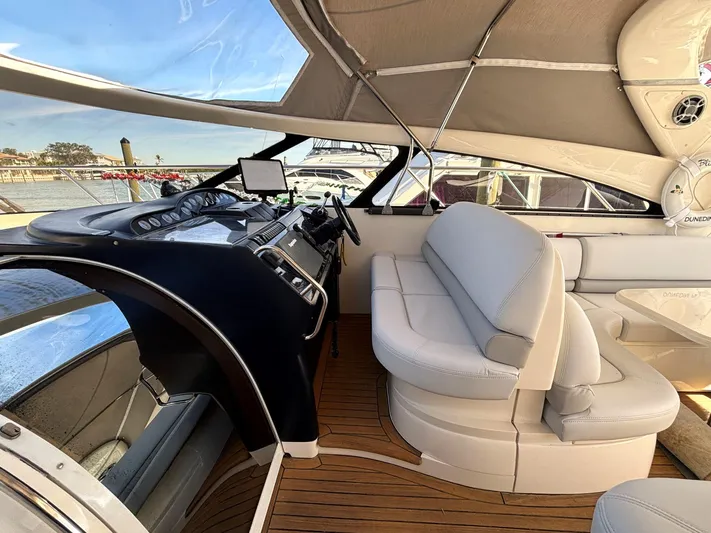 Blind Date Yacht Photos Pics Interior of 2005 Viking Princess V50 yacht with sleek helm and comfortable seating.