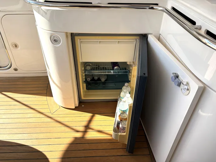 Blind Date Yacht Photos Pics Open mini fridge on 2005 Viking Princess V50 yacht with drinks inside.