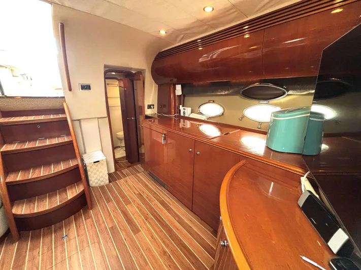 Blind Date Yacht Photos Pics Luxurious 2005 Viking Princess V50 yacht interior with polished wood finishes and modern amenities.