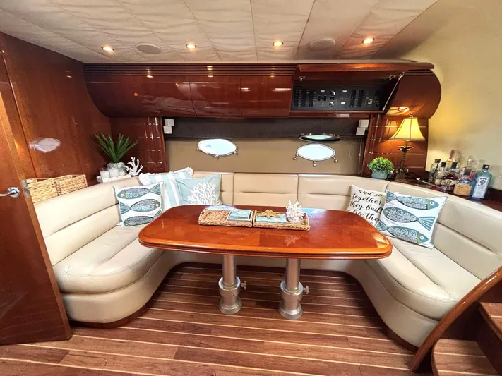 Blind Date Yacht Photos Pics Luxurious 2005 Viking Princess V50 yacht interior with elegant seating and wooden table.