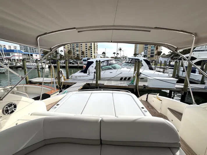 Blind Date Yacht Photos Pics 2005 Viking Princess V50 yacht interior view at marina, showcasing luxury seating and docked boats.