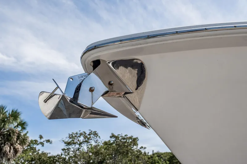  Yacht Photos Pics Bow of 2021 Everglades 335 Center Console with anchor, under blue sky.