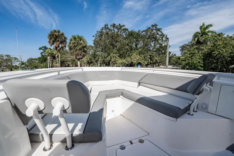  Yacht Photos Pics 2021 Everglades 335 Center Console boat with spacious seating, set against a scenic backdrop.