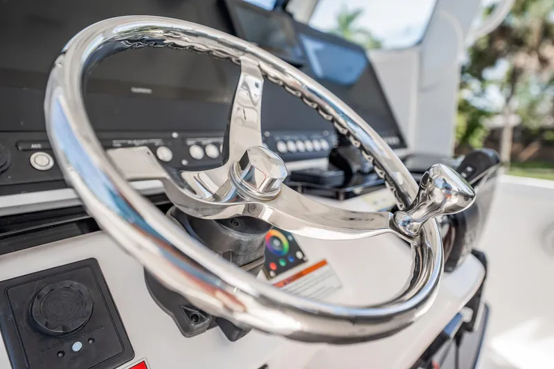  Yacht Photos Pics Steering wheel of 2021 Everglades 335 Center Console boat, featuring modern controls.