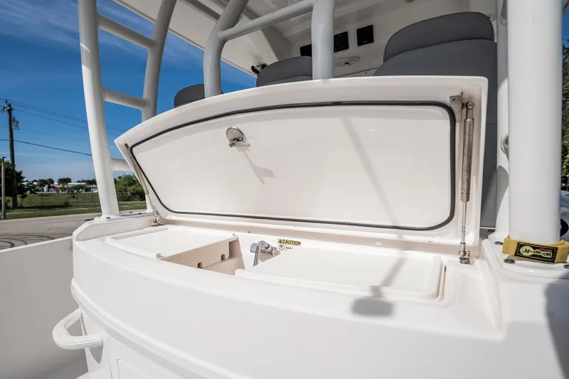  Yacht Photos Pics 2021 Everglades 335 Center Console boat with open storage compartment, showcasing sleek design.