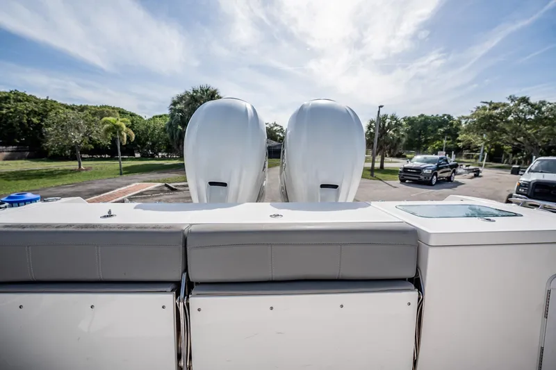  Yacht Photos Pics 2021 Everglades 335 Center Console boat with dual engines, parked outdoors.