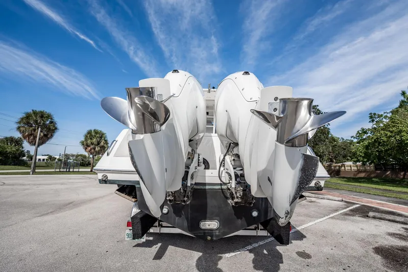  Yacht Photos Pics 2021 Everglades 335 Center Console boat with dual outboard engines in a parking lot.