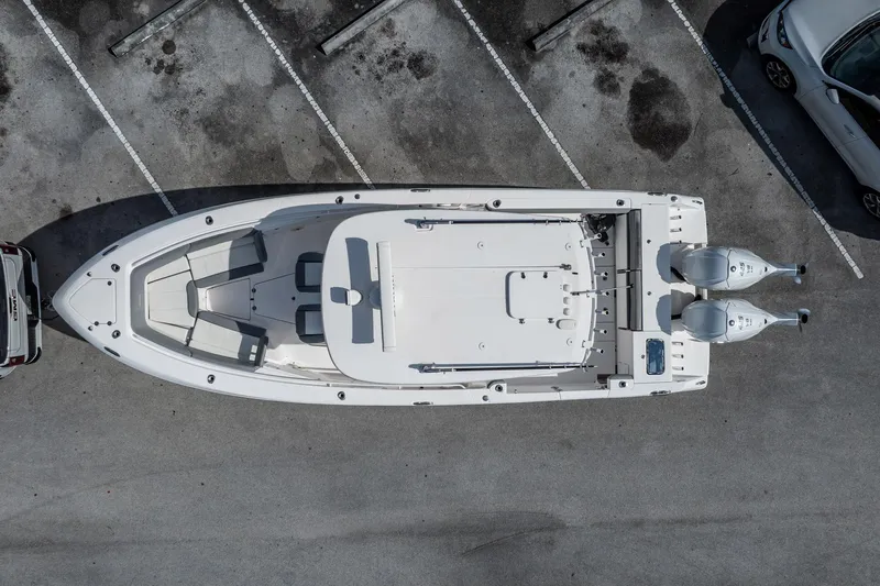  Yacht Photos Pics Aerial view of 2021 Everglades 335 Center Console boat in parking lot.