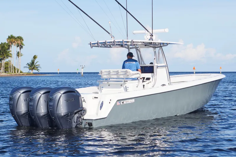 Yacht Photos Pics 2022 Contender 35 ST boat with triple Yamaha engines on calm water.