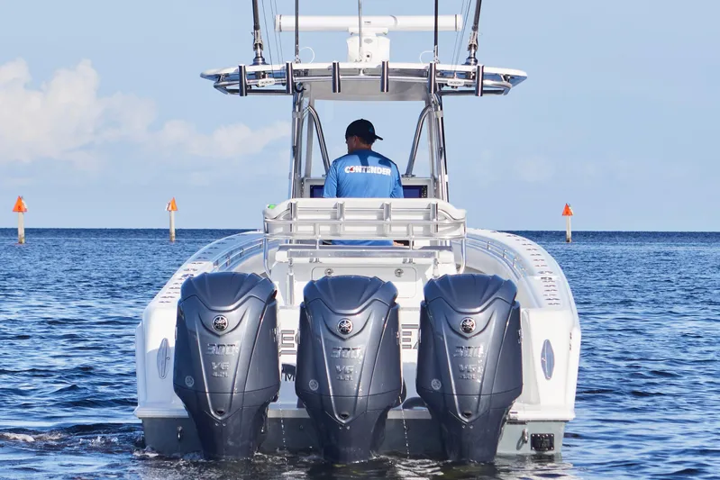  Yacht Photos Pics 2022 Contender 35 ST boat with triple Yamaha engines on open water.