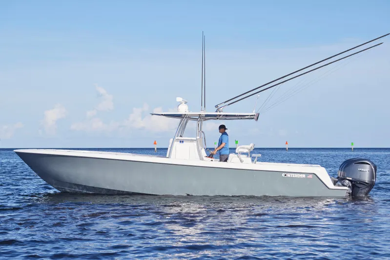  Yacht Photos Pics 2022 Contender 35 ST boat cruising on calm ocean waters.