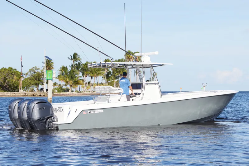  Yacht Photos Pics 2022 Contender 35 ST boat with triple Yamaha engines on calm water.