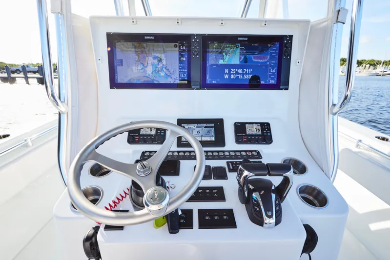  Yacht Photos Pics 2022 Contender 35 ST boat dashboard with navigation screens and controls.
