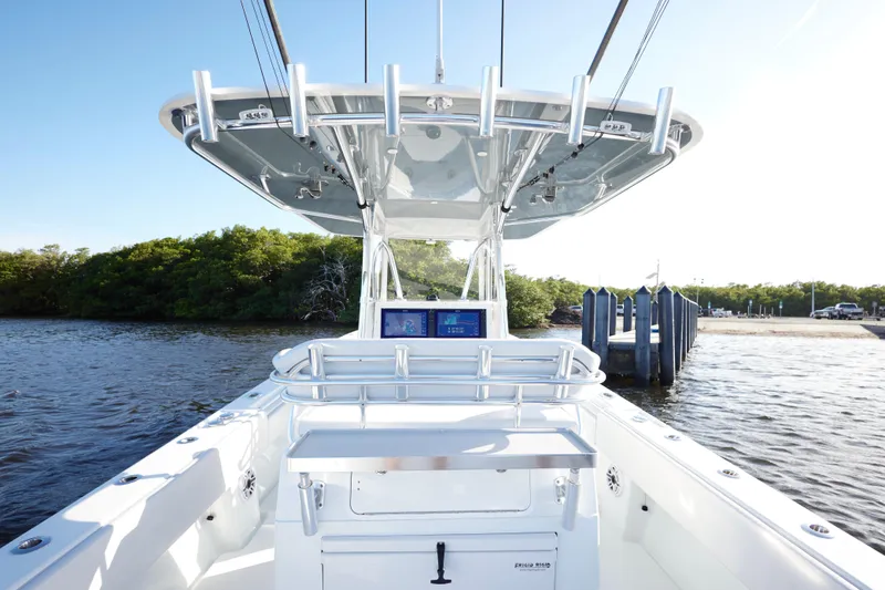  Yacht Photos Pics 2022 Contender 35 ST boat at dock, featuring sleek design and advanced navigation equipment.