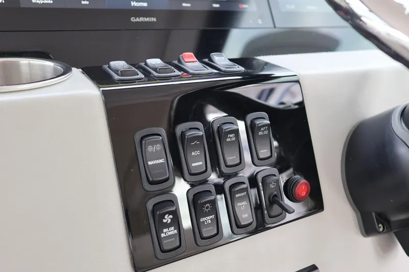  Yacht Photos Pics Control panel of 2022 Regal 36 XO boat with various switches and buttons.