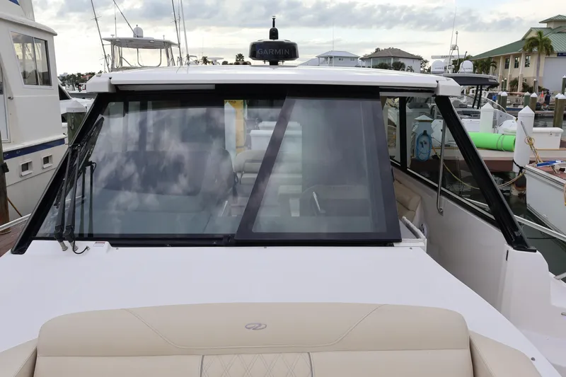  Yacht Photos Pics 2022 Regal 36 XO boat docked, featuring sleek design and modern windshield.