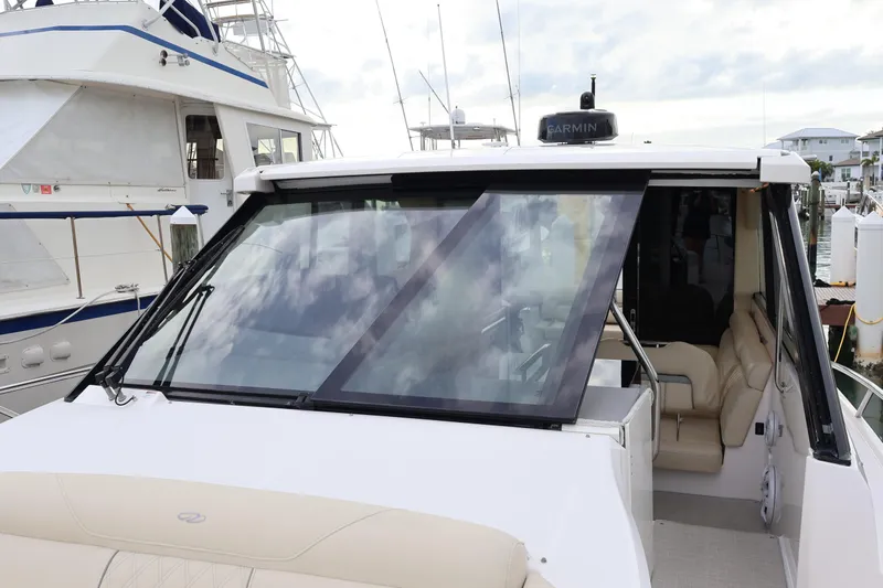  Yacht Photos Pics 2022 Regal 36 XO yacht with sleek design and luxurious interior at marina.