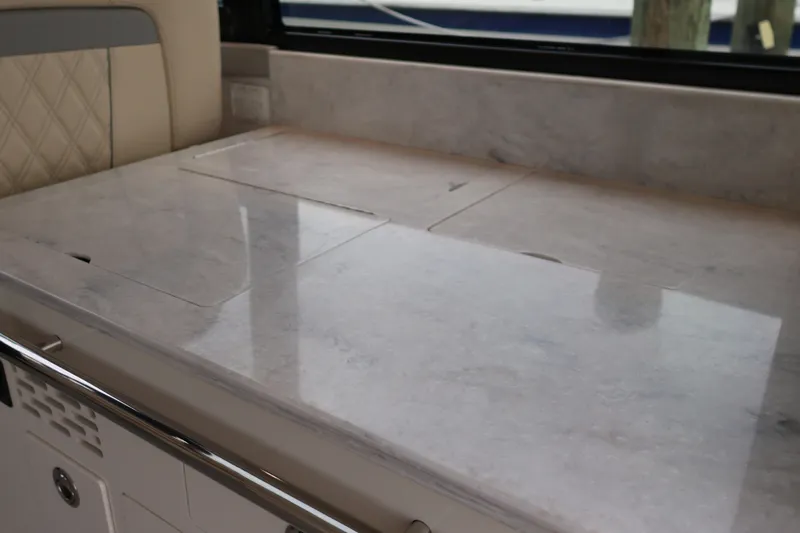  Yacht Photos Pics Luxurious marble countertop in 2022 Regal 36 XO yacht interior.