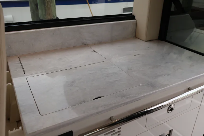  Yacht Photos Pics 2022 Regal 36 XO yacht interior with sleek marble countertop design.