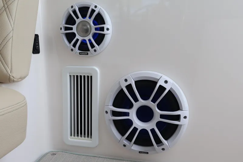  Yacht Photos Pics 2022 Regal 36 XO boat speakers and vent detail, featuring Fusion audio system.