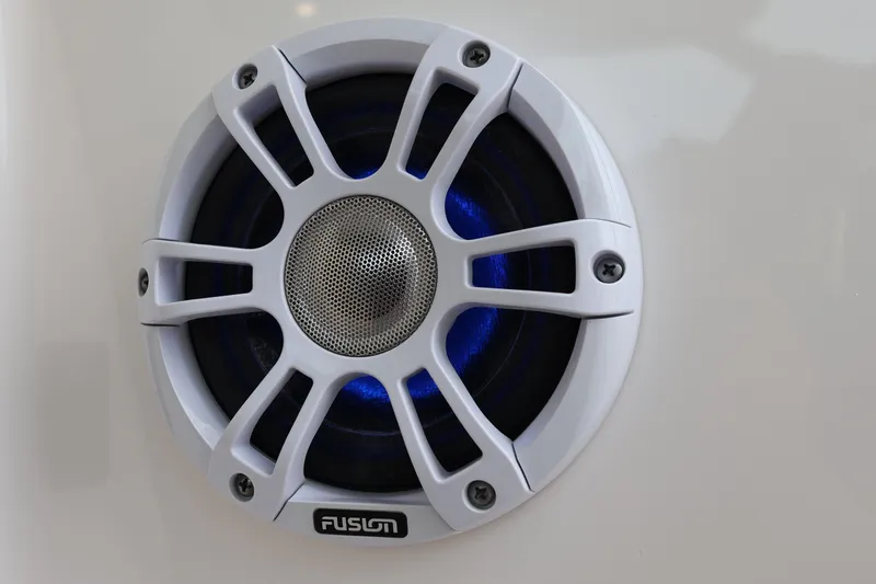  Yacht Photos Pics White Fusion speaker on 2022 Regal 36 XO boat, featuring blue LED lighting.