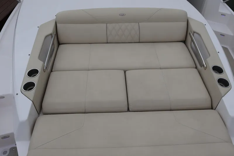  Yacht Photos Pics Luxurious seating area on 2022 Regal 36 XO boat with cup holders.