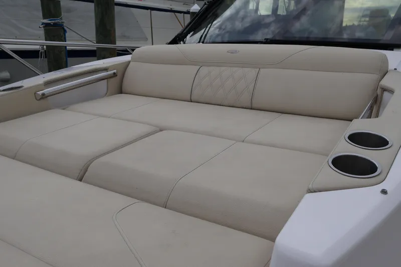  Yacht Photos Pics 2022 Regal 36 XO boat with luxurious beige seating and cup holders.