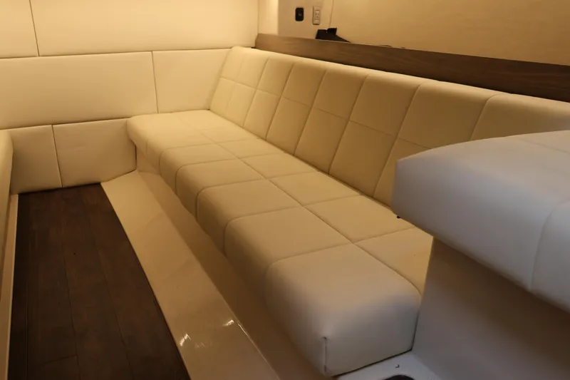  Yacht Photos Pics Luxurious interior seating of 2022 Regal 36 XO yacht with cream upholstery.