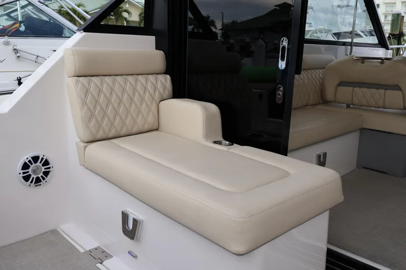  Yacht Photos Pics Luxurious seating on 2022 Regal 36 XO boat, featuring beige upholstery and modern design.