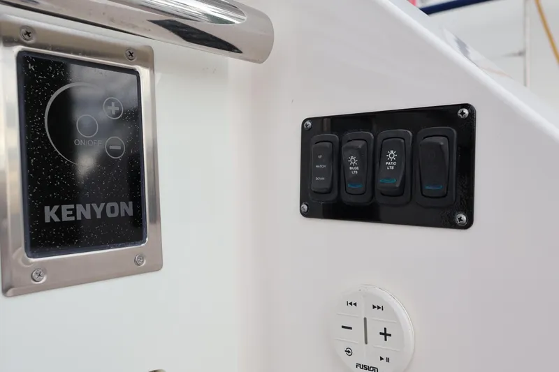  Yacht Photos Pics Control panel on 2022 Regal 36 XO boat with Kenyon and Fusion interfaces.