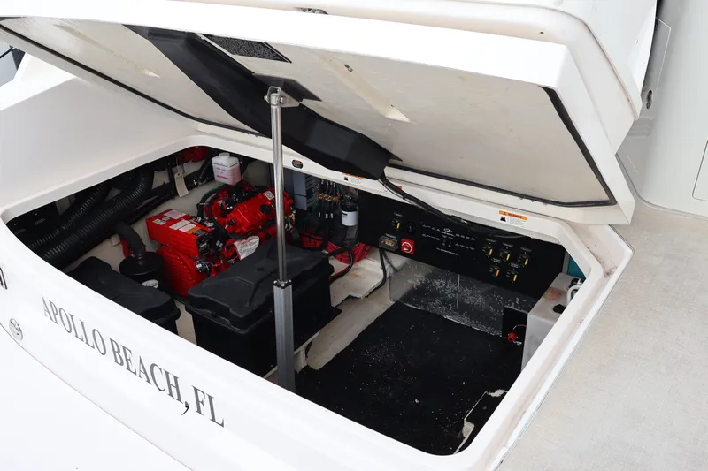  Yacht Photos Pics 2022 Regal 36 XO boat engine compartment, Apollo Beach, FL, showing battery and control panel.
