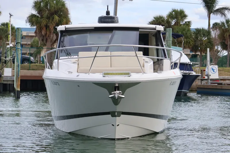  Yacht Photos Pics 2022 Regal 36 XO boat docked in marina, front view with palm trees in background.