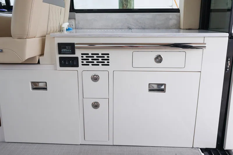  Yacht Photos Pics 2022 Regal 36 XO yacht interior with sleek white cabinetry and modern design.