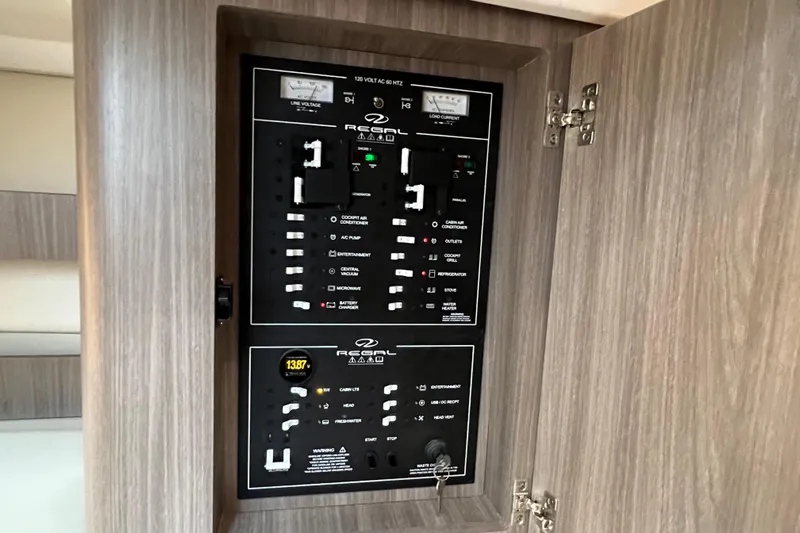  Yacht Photos Pics Electrical control panel of 2022 Regal 36 XO boat, featuring various switches and indicators.